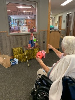 Henny Karlin plays a can toss game during the fair.