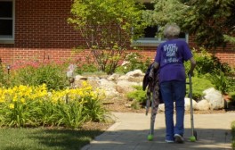 A resident walks through the therapeutic courtyard at Good Samaritan - Canton in Canton, S. D.